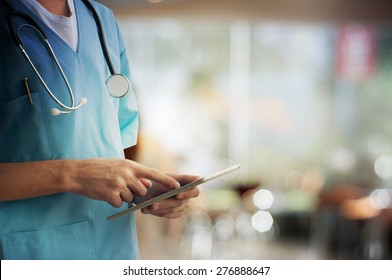Healthcare And Medicine. Doctor using a digital tablet - Shutterstock ID 276888647