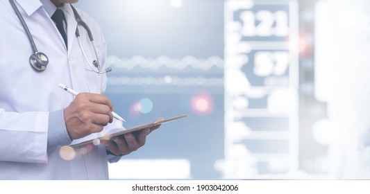 Healthcare and medicine, medical technology, telemedicine concept. Doctor using digital tablet recording patient's health report with vital signs monitor in hospital as background