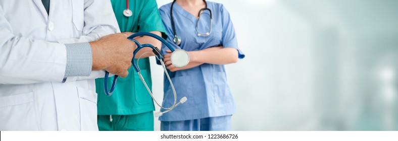 Healthcare people group. Professional doctor working in hospital office or clinic with other doctors, nurse and surgeon. Medical technology research institute and doctor staff service concept. - Shutterstock ID 1223686726