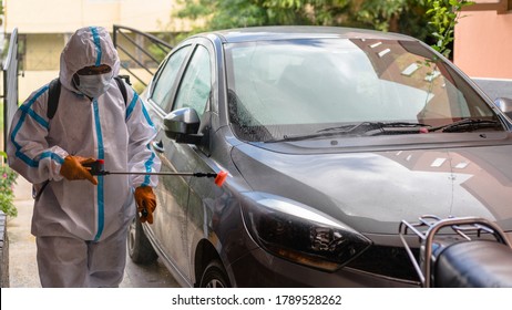 Healthcare Personnel Wearing Personal Protective Equipment And Disinfecting A Car Of A Patient Tested Covid 19 Positive In India. Coronavirus Disease Preventive Measures By The Government