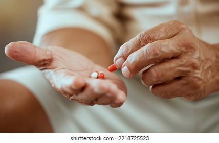 Healthcare, Pills And Hands Of Elderly Person With Capsules, Medication And Treatment In Palm. Health, Wellness And Senior Citizen With Medicine For Ache, Joint Pain And Arthritis In Retirement Home