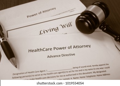 Healthcare Power of Attorney, Living Will documents with legal gavel