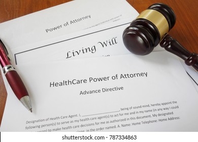 Healthcare Power of Attorney, Living Will and Power of Attorney documents with gavel