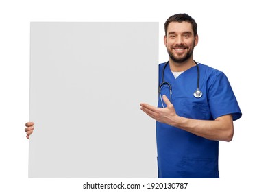 Healthcare, Profession And Medicine Concept - Happy Smiling Male Doctor Or Nurse In Blue Uniform With Big Board Over White Background