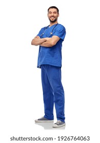 Healthcare, Profession And Medicine Concept - Happy Smiling Doctor Or Male Nurse In Blue Uniform With Stethoscope Over White Background