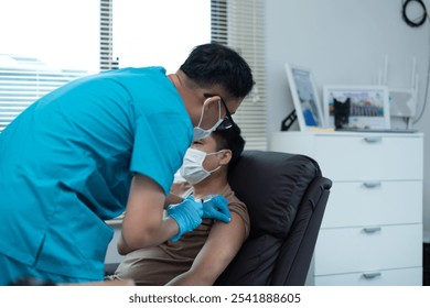 Healthcare Professional Administering COVID-19 Vaccine to Patient in Medical Office - Powered by Shutterstock