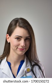 Healthcare Professional Head Shot Up Close Isolated On Grey Background. Medical Portrait Of Female Doctor Or Nurse Practitioner