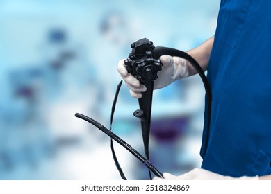 Healthcare professional preparing an endoscope for a medical examination in a clinical setting. - Powered by Shutterstock