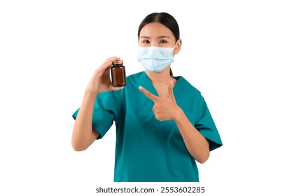 Healthcare professional in scrubs holding a medicine bottle and pointing, isolated on white background.