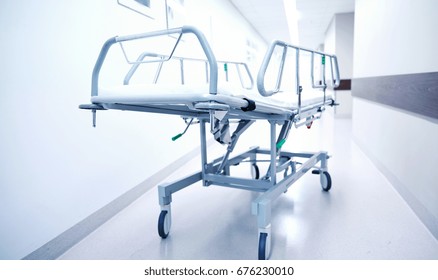 healthcare, reanimation, emergency room and medicine concept - gurney or wheeled stretcher at hospital corridor - Powered by Shutterstock