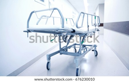 healthcare, reanimation, emergency room and medicine concept - gurney or wheeled stretcher at hospital corridor Foto d'archivio © 