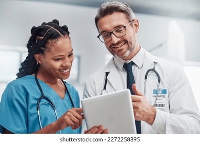 Healthcare, research and doctors with tablet, conversation or data analytics in hospital. Medical professionals, black woman or man with device, discussion or search internet for cure or update chart - Powered by Shutterstock