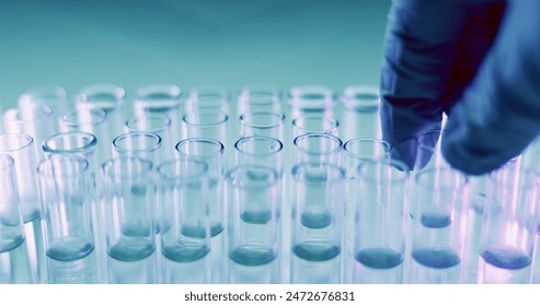 Healthcare, scientist and hand with test tube in lab for medical exam, investigation and development. Science, innovation and person with equipment for vaccine study, bacteria sample and research - Powered by Shutterstock