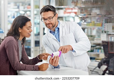 Healthcare service and pharmacy worker with customer at store counter for medication explanation. Pharmaceutical advice and opinion of pharmacist helping girl with medicine information. - Powered by Shutterstock