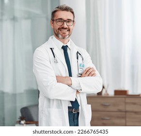 Healthcare, smile and portrait of doctor, man in hospital for support, success and help in medical work. Health, wellness and medicine, confident mature professional with stethoscope and leadership. - Powered by Shutterstock