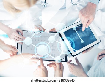 Healthcare, Technology, Medicine And People Concept - Group Of Doctors With Tablet Pc, Clipboard And Molecular Projection