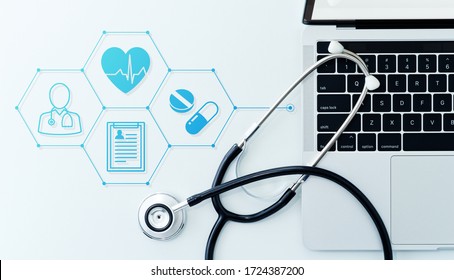 Healthcare Technology And Telemedicine Concept. Stethoscope And Laptop On White Background. 
