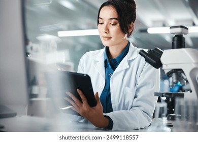 Healthcare, woman and scientist with tablet in lab for microscope research, medical data and science information. Person, researcher and digital for study feedback, vaccine solution and biotechnology