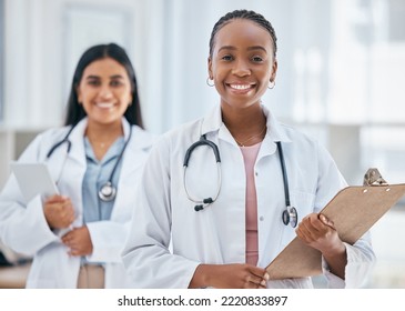Healthcare, women and doctors with patient chart on clipboard in hospital or clinic. Happy black woman doctor, medical partnership and insurance documents, diversity and leadership in health care.