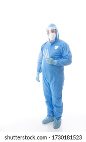 Healthcare Worker In Full PPE Coverall With Mask, Gloves, Shield And Shoe Covers Is Holding Swabs For Coronavirus Pandemic