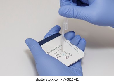 Healthcare Worker Performing An Influenza Test