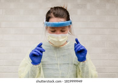 Healthcare Worker Registered Nurse With Mask Gloves Face Shield Gown Ppe In Front Of White Background