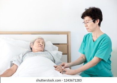 Healthcare Worker Screening Old Asian Patient , Elderly Health Check Up , Palliative Care