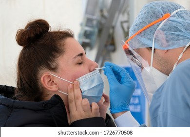 A healthcare worker takes a nasal swab sample to test for the coronavirus in University Hospital of Liege in Belgium on May 5th, 2020