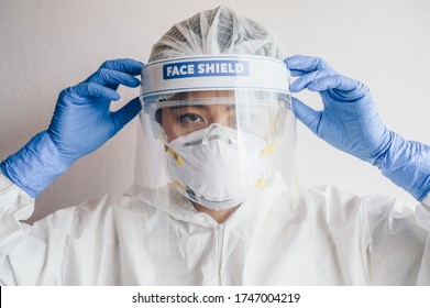 Healthcare Worker Wearing PPE Suit For Working In Hospital During Covid-19 Pandemic Outbreak. PPE Is Equipment That Will Protect The User Against Health Or Safety Risks At Work.