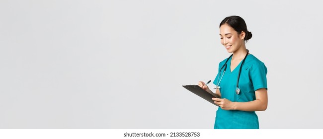 Healthcare Workers, Preventing Virus, Quarantine Campaign Concept. Beautiful Smiling Asian Doctor, Nurse Running Checkup In Hospital, Looking At Clipboard With Patient Results, Examine People