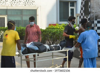 Healthcare Workers Transfer The Body Of A Person Who Died From The Coronavirus Disease (COVID-19), Inside A Hospital Premises In Kolkata, India, May 14, 2021.