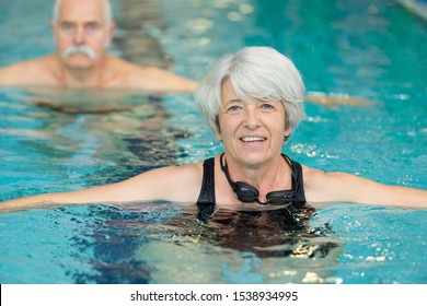 Healthy Active Senior Woman Swimming In The Pool