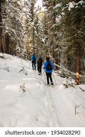 Healthy, Active Seniors Snowshoeing In Wyoming. Winter Snow Landscape. Friends Trekking In The Snow Together. Snowshoes.