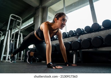 Healthy Asian athlete woman do running plank workout exercise body weight lifting at fitness gym. Strong female do body muscle building weight training at sport club. Health care motivation concept - Powered by Shutterstock