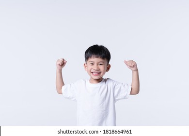 Healthy Asian boy about 4 year olds with strong arm gesture - Shutterstock ID 1818664961