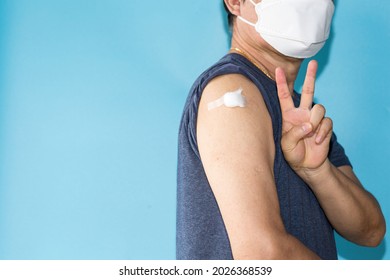 Healthy Asian Man Getting Vaccinated Immunity Giving Win Hand Sign To Rolling Out Vaccine, Concept Of Recommended Inoculation, Vaccination, Vaccinated Patient, Vaccine Roll-out Program
