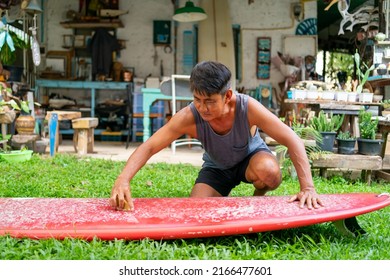 Healthy Asian senior man waxing surfboard surface at home. Active elderly male surfer enjoy outdoor lifestyle surfing at the sea on summer vacation. Retirement people activity and water sport concept. - Powered by Shutterstock