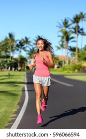 Healthy Asian Woman Runner Jogging On Urban Road. Fitness Girl Athlete Working Out Living An Active Lifestyle Training Cardio In The Morning Running In Pink Activewear. Full Body.