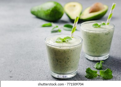 Healthy avocado spinach green smoothie. Selective focus, close up, copy space.  - Powered by Shutterstock