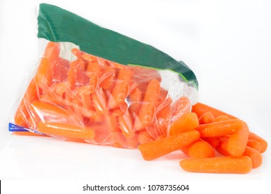 Healthy Baby Carrots Spilling From Plastic Grocery Store Bag. No Label.