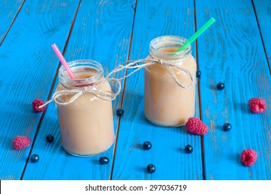 Healthy Baby Food: Apple Banana Or Apricot Puree In Mason Jar, Fresh Raspberry. Light Rural Wooden Background. Unique Perspective, Selective Focus.