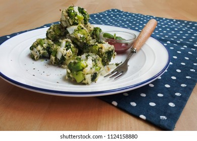 Healthy Baked Broccoli Tots With Ketchup And Basil (white Plate, Wooden Table, Wooden Fork, Blue And White Dot Placemat)