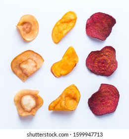 Healthy balanced food, clean eating, naturally flavoured snacks, transparent ingredients concept. Dried vegetables, dehydrated sweet potato, parsnip, beetroot chips on a white background - Powered by Shutterstock