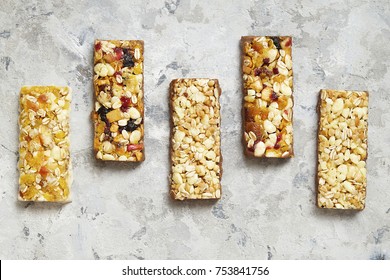 Healthy bars with nuts, seeds and dried fruits on the table, with copy space - Powered by Shutterstock