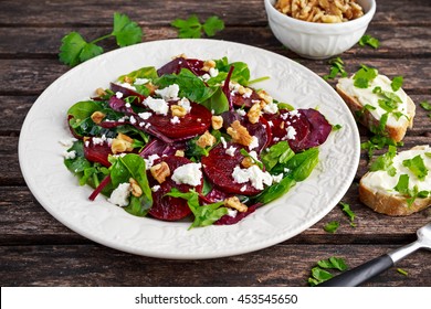 Healthy Beet Salad With Fresh Sweet Baby Spinach, Kale Lettuce, Nuts, Feta Cheese And Toast  Melted 