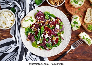 Healthy Beet Salad With Fresh Sweet Baby Spinach, Kale Lettuce, Nuts, Feta Cheese And Toast  Melted 