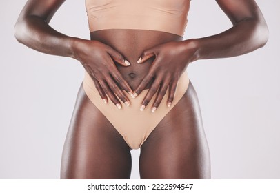 Healthy black woman, heart hands and stomach diet, weightloss wellness and gut health, body contouring and slimming on studio background. Fitness model abdomen, love and digestion, skincare and belly - Shutterstock ID 2222594547