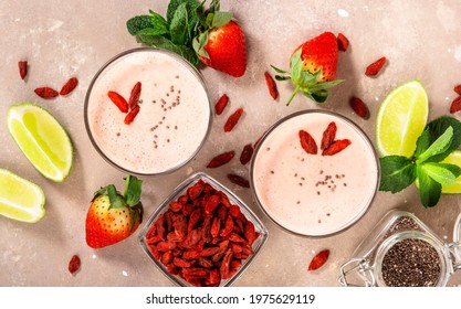 Healthy blended diet smoothie drink with strawberry and goji berries, chia seeds and lime. Top view - Powered by Shutterstock