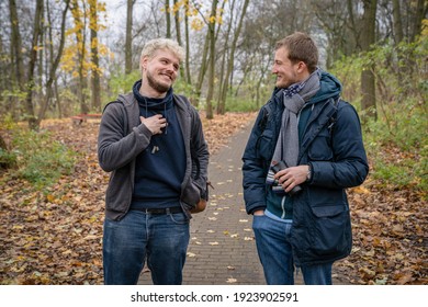 Healthy Blonde Man Living With HIV Walking On Path In A Park In Hamburg, Germany With His Friend