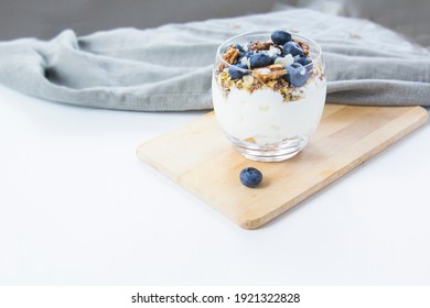 Healthy Blueberry And Walnut Parfait In A Glass On A White Background